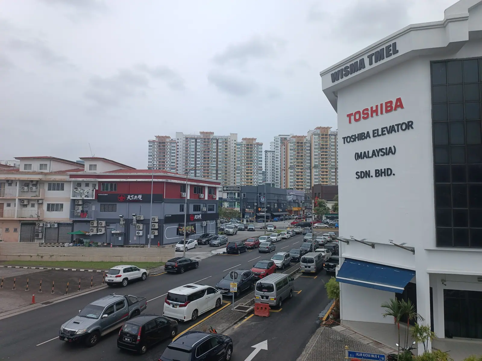 Shoplots and traffic in Kuchai Lama, close to karaoke Sri Petaling venues