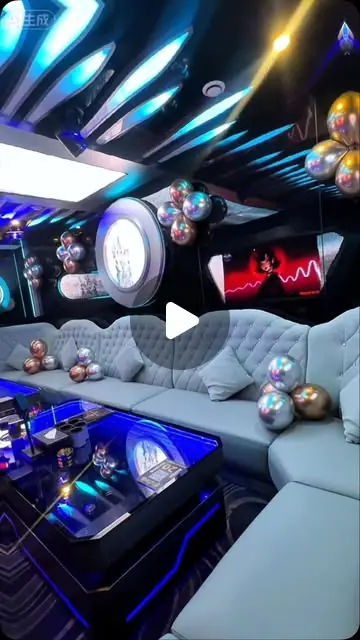 De-Millionaire KTV (富豪城): Small KTV room with grey tufted sofas, LED-lit table and balloon decorations (reel frame, play icon overlay)