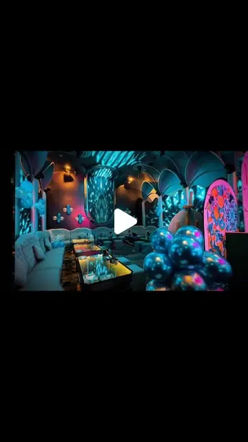De-Millionaire KTV (富豪城): Wide view of a decorated KTV room with sofas and balloon clusters (reel frame, play icon overlay)